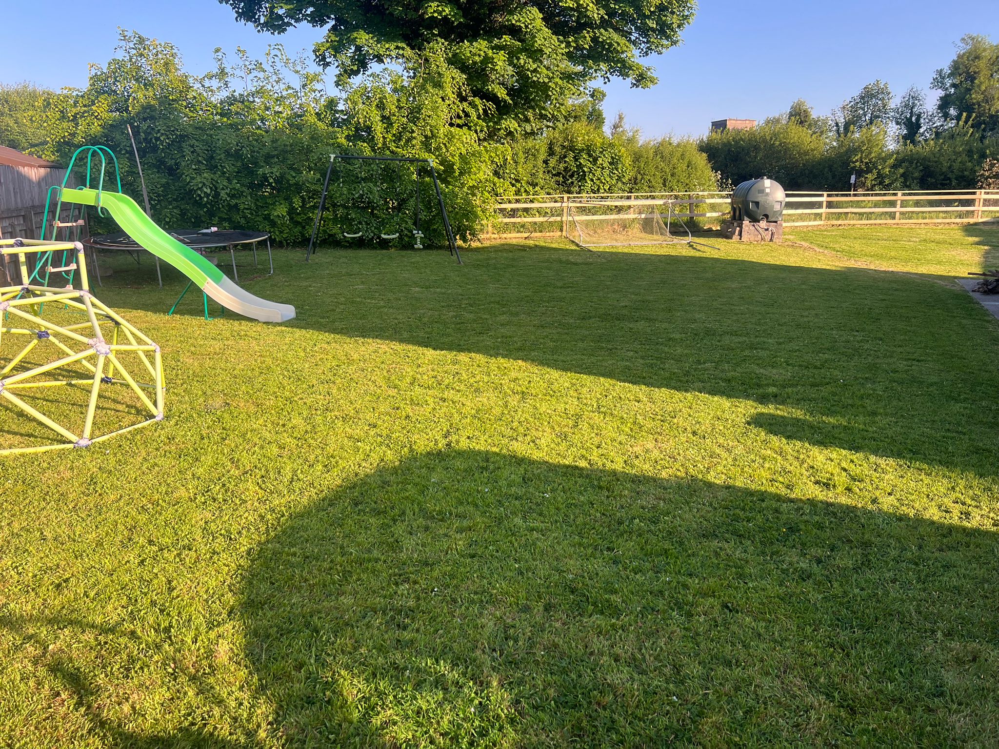 Well-maintained family garden with play equipment